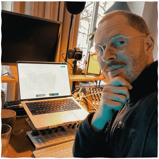 Happy-looking mxmx sitting at desk